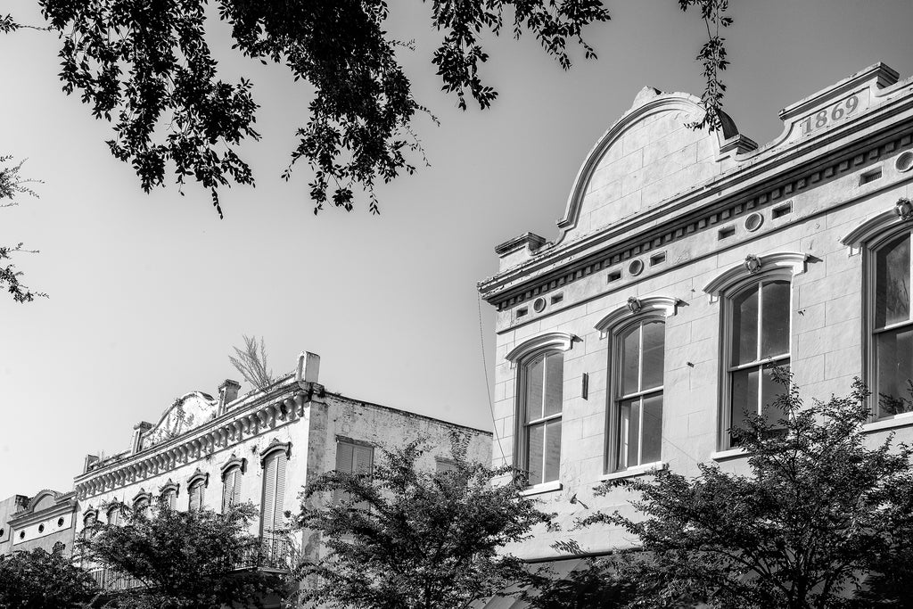 Black and white photograph of historic storefronts on Main Street in beautiful downtown Natchez, Mississippi.