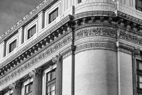 Black and white photograph of ornate details on the historic Gryphon Building in Savannah.