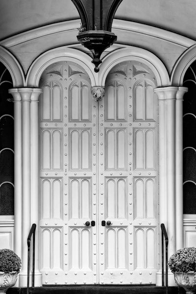 Black and white photograph of magnificent white double doors on a historic building in Savannah, Georgia.
