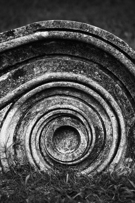 Black and white detail photograph of a Greek Revival column fragment spiral motif. Removed from the original Tennessee State Capitol building in Nashville, Tennessee during a renovation, these pieces of stone columns have been scattered around Nashville as a reminder of its reputation as "the Athens of the South."