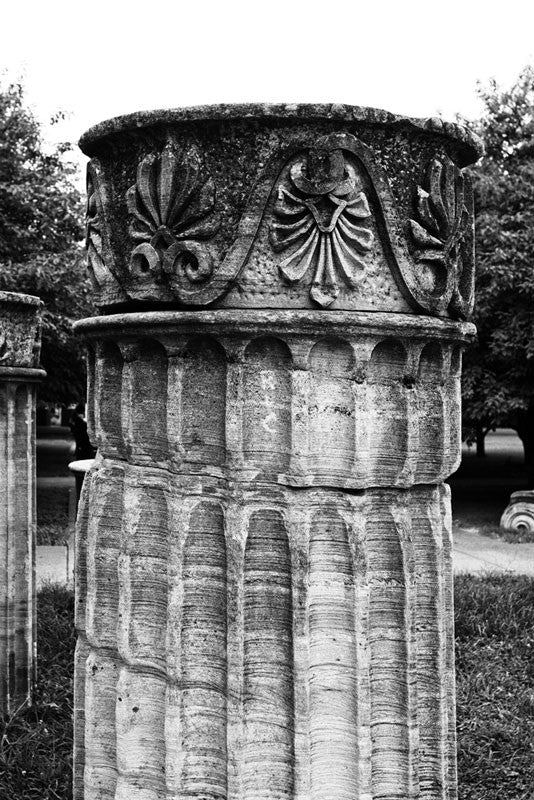 Black and white photograph of a Greek Revival column in Nashville. Originally part of the Tennessee State Capitol building, these columns were removed during a renovation and have been scattered around Nashville as a reminder of its reputation as "the Athens of the South."