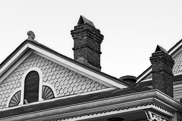 Black and white photograph of a beautiful old Victorian house in the New Orleans French Quarter. 