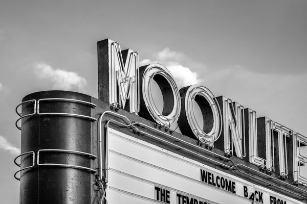 Black and white photograph of the vintage neon Moonlite Theatre marquee found in the beautiful town of Abington, Virginia. The theatre was built in 1949. After sitting abandoned and neglected for many years, the theatre has found new life and activity recently.