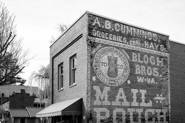 Black and white photograph of the historic Mail Pouch building in Jonesborough, Tennessee, nicknamed for the large hand-painted ghost sign wall ad on its side.
