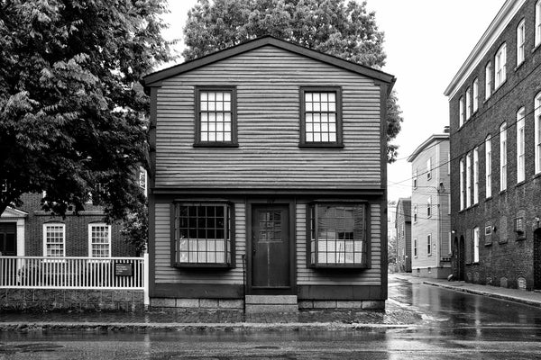 Black and white photograph of the historic West India Goods Store in Salem, Massachusetts. This early 1800s retail store dates back to the era when Salem was an international shipping port, wealthy from the trade of exotic spices, tobacco, and other goods.