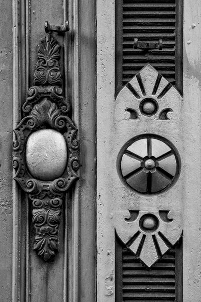 Black and white photograph of Victorian-era architectural details on a building in downtown Rochester, New York.