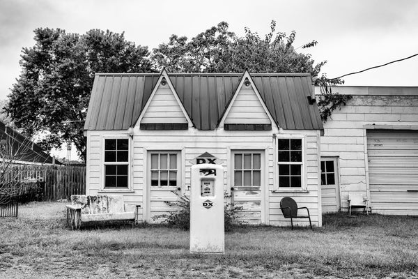 Black and white photograph of a long ago closed vintage DX gasoline station in a small town in southern Illinois.