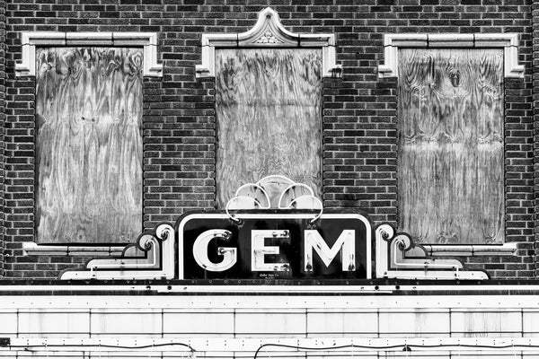 Black and white photograph of the vintage marquee sign of the long-abandoned Gem Theatre in Cairo, Illinois, which closed permanently in 1978.