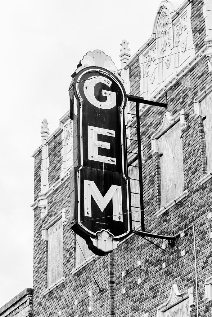 Black and white photograph of the vintage marquee sign of the historic and abandoned Gem Theatre in Cairo, Illinois. A theatre has existed on the location since about 1910, with several fires and reconstructions over the years. The theatre closed permanently in 1978.
