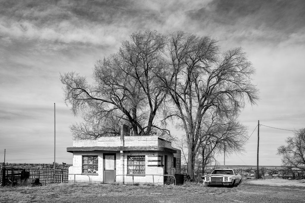 Black and white photograph of an abandoned Art Moderne diner on old Route 66, built 1952.