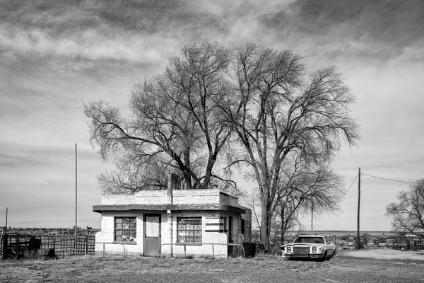 Black and white photograph of an abandoned Art Moderne diner on old Route 66, built 1952.