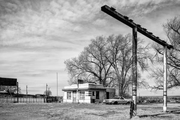 Black and white photograph of an abandoned diner on old Route 66, built 1952 in Glenrio, Texas. Once a busy stop for travelers along Route 66, Glenrio is now essentially a ghost town with only a handful of residents remaining.