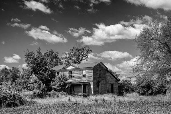 Black and white photograph of an abandoned rural farmhouse located very near to the ghost town at Union Level, Virginia.