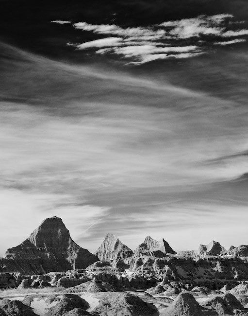 Black and white landscape photograph of the otherworldly Badlands of South Dakota.