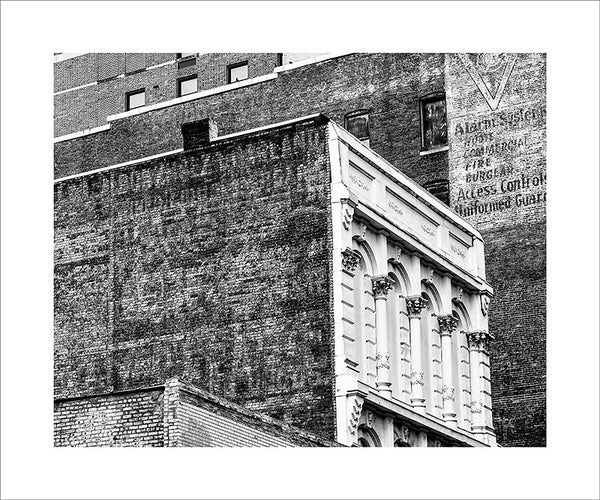 Black and white photograph historic buildings in downtown Nashville, featuring fading and peeling painted ads on their expansive brick walls.  This photograph can be seen in the Nashville Room, a private dining room at Nashville's amazing Prima Restaurant in the Gulch neighborhood. At 16" x 20," this is the exact size and finish as the print at Prima -- just add your own top mat and framing.
