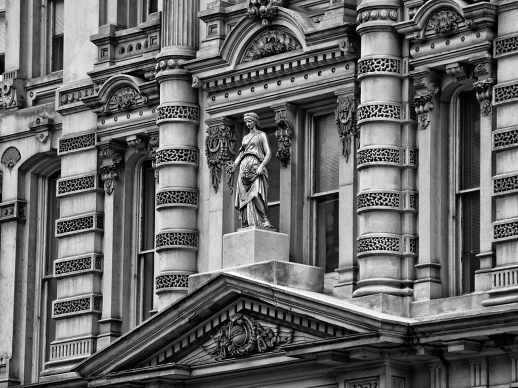 Black and white photograph of the ornate front facade of the Mitchell Building, in downtown Milwaukee. A large print of this photograph can be seen in the Jackson Meeting Room at the Marriott Downtown Milwaukee.