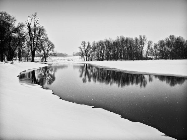 Black and white landscape photograph made on the location of a former Native American village of the Ho-Chunk (Winnebago) tribe in southern Wisconsin. They lived in this beautiful place, near the river, from the 1700s until 1832, when the village was burned in an intra-tribal attack, associated with the Black Hawk war. The name “Burnt Village” was ascribed to the location by the U.S. Army, which camped here afterwards in pursuit of the warrior Black Hawk.