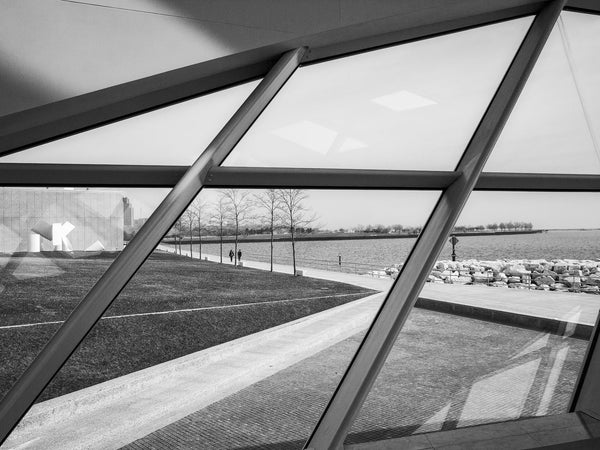 Black and white photograph of the view of Lake Michigan from the windows of Milwaukee Art Museum's stunning Calatrava building.