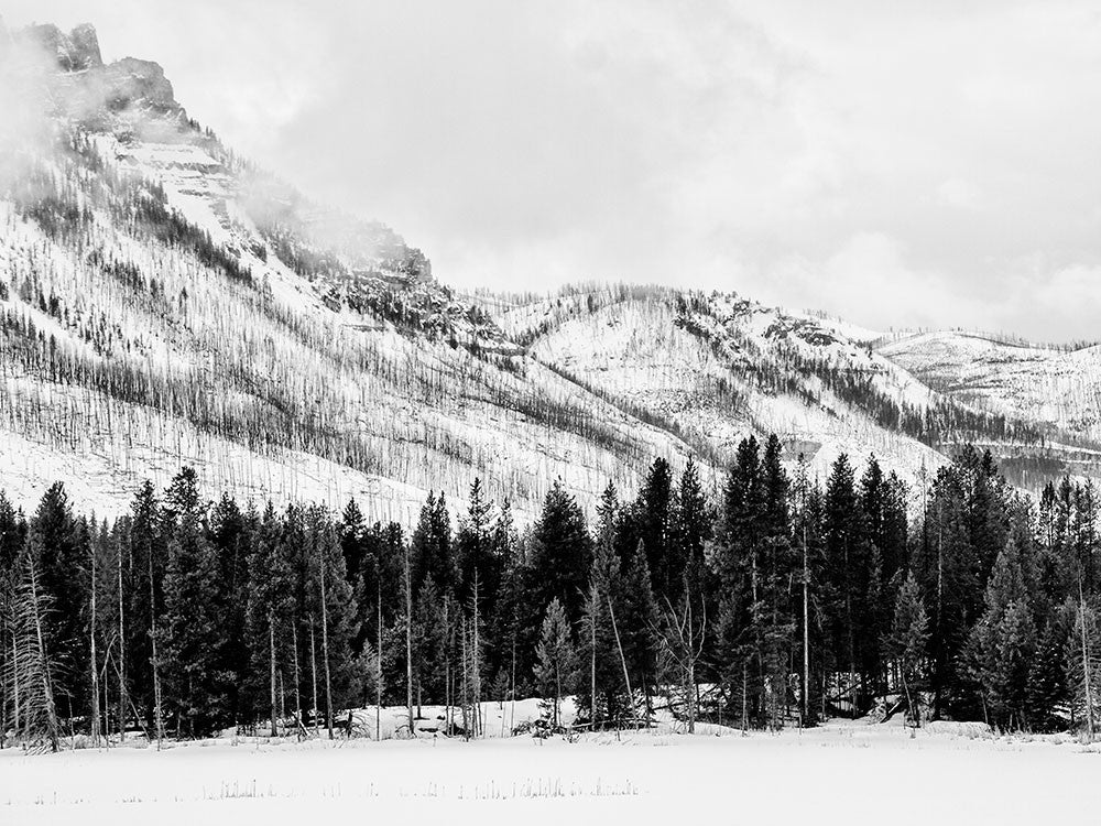 Black and white landscape photograph of Wyoming's Beartooth Mountains in snow.