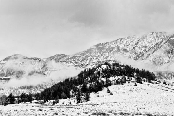 Black and white landscape photograph of Wyoming's Beartooth Mountains in winter. 