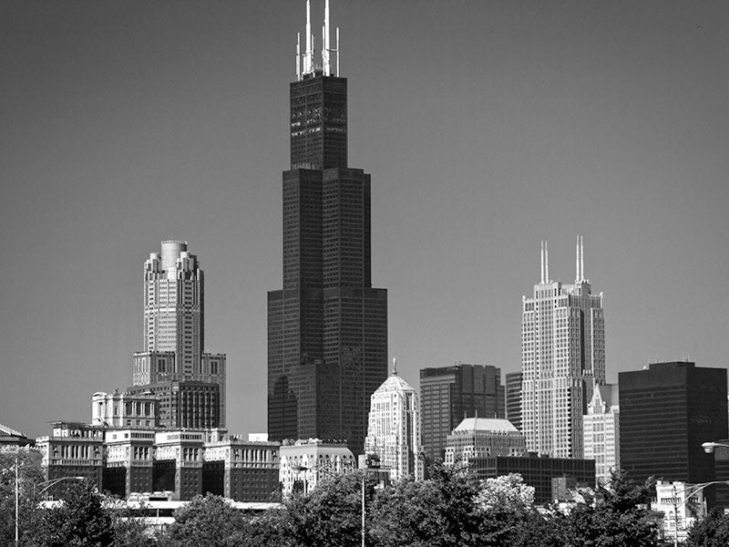Black and white photograph of the stunning world-class Chicago skyline, focused on the tall black Willis Tower (formerly known as the Sears Tower), which was the tallest building in the world from 1973 - 1998.