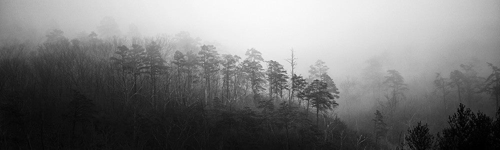 Black and white landscape photograph of foggy mountain ridges in the Smoky Mountains. This is a wide view panorama currently available only in one size: 20 inches wide x 6 inches tall.