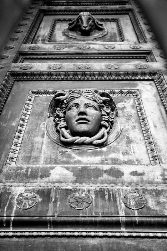 Black and white photograph of one of the the massive bronze doors on the entrance to Nashville's replica of the Athenian Parthenon, located in Centennial Park in the city's West End. Each of the four double-doors is 24 feet tall, one foot thick, and weighs seven and a half tons.