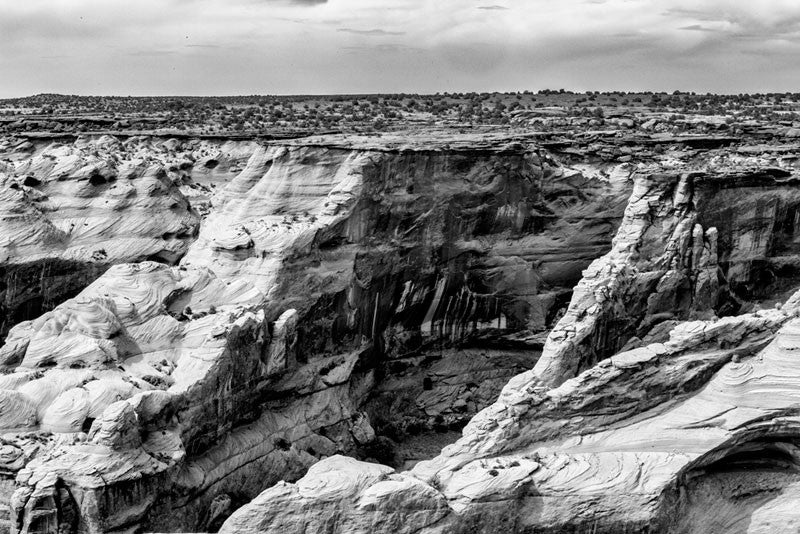 Black and white landscape photograph of Canyon de Chelly in Arizona.