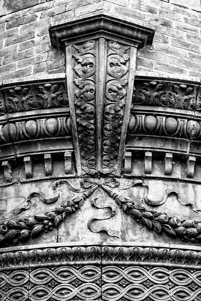 Black and white photograph of a beautiful architectural detail on a historic building in Nashville's Lower Broadway honky tonk district at 2nd Avenue. The structure is currently home to Hard Rock Cafe's gift shop, but opened in the 1890s as the Silver Dollar Saloon, serving riverboat men from the nearby Cumberland River. Also known as the V. E. Schwab Building.
