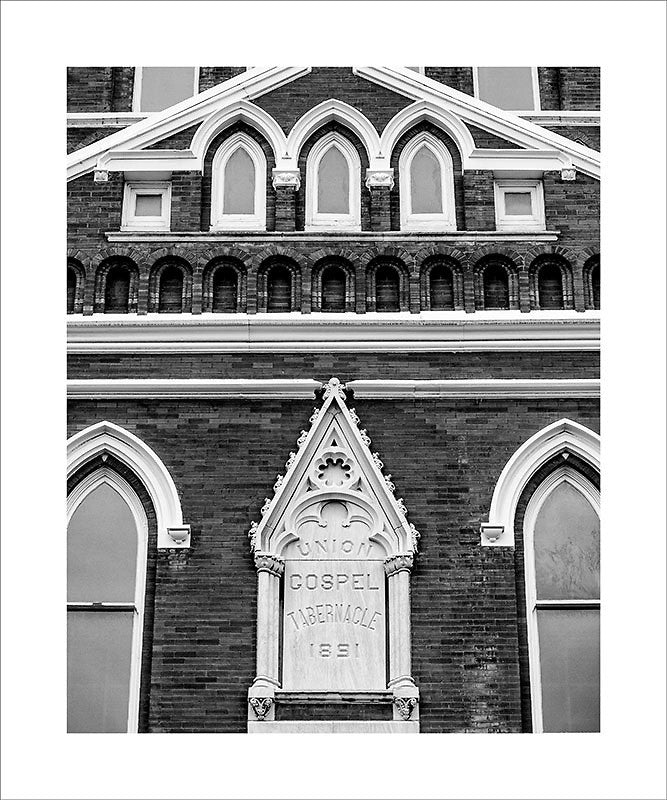 Black and white photograph historic Ryman Auditorium in downtown Nashville, known as the "mother church of country music," because it started out as the Union Gospel Tabernacle in 1891.  This photograph can be seen in the Nashville Room, a private dining room at Nashville's amazing Prima Restaurant in the Gulch neighborhood. At 16" x 20," this is the exact size and finish as the print at Prima -- just add your own top mat and framing.