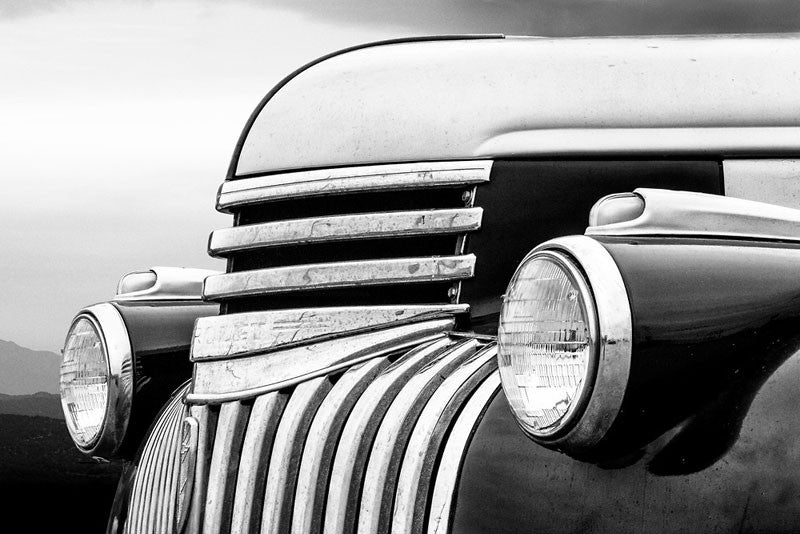 Black and white fine art photograph of an antique 1947 Chevrolet in the mountain landscape.