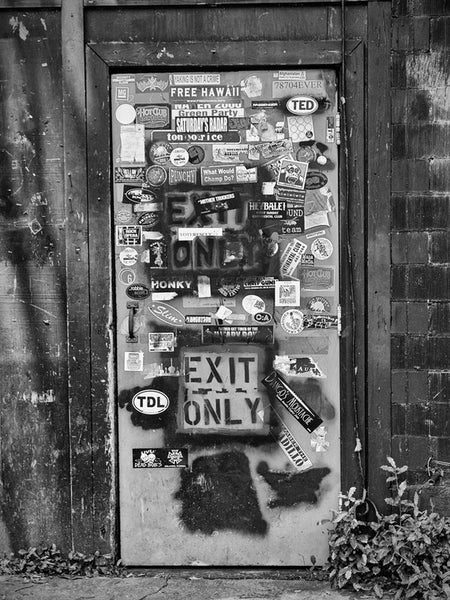 Black and white photograph of the back door to the famous -- even historic --Continental Club on South Congress in Austin, Texas.