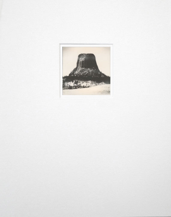 One-of-a-kind original Polaroid photograph of a winter landscape featuring the famous Devil's Tower in Wyoming. This is the same mountain seen in "Close Encounters," and other movies. This is a unique Keith Dotson photo -- there are no others.