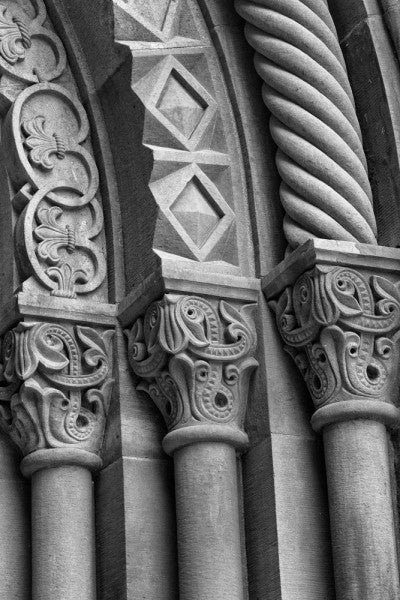 Black and white architectural detail photograph of ornately carved stone columns at the Smithsonian Institution in Washington, DC.