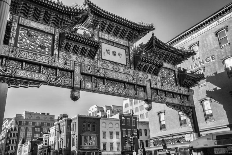 Black and white photograph of the ornate gate at the entrance to the Chinatown neighborhood of Washington, DC.